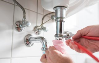 sink pipes being tightened